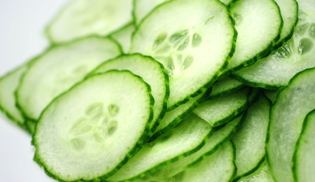 Cucumber slices on white background